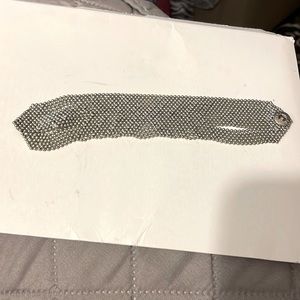 Silver color bracelet.